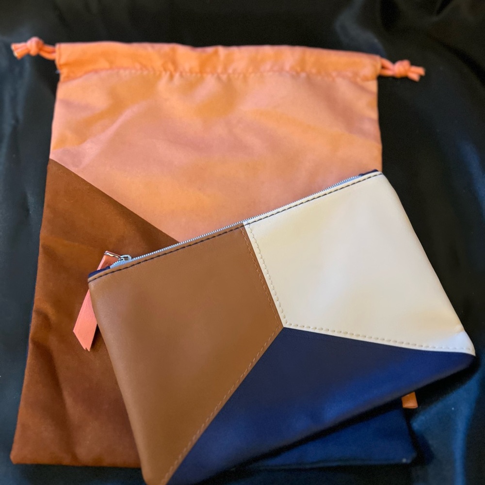 2 Ipsy bags, never used. One is a drawstring cloth bag and the other zips.